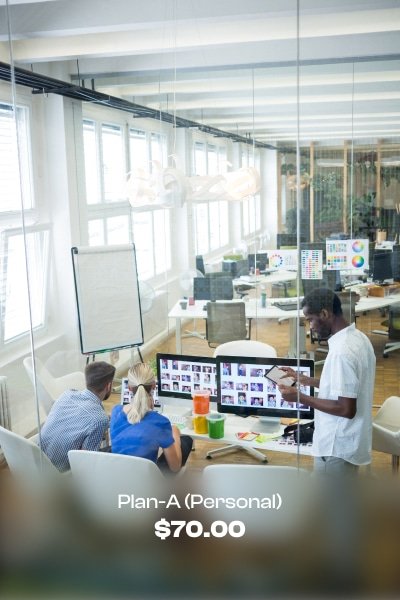 a group of people working on computers