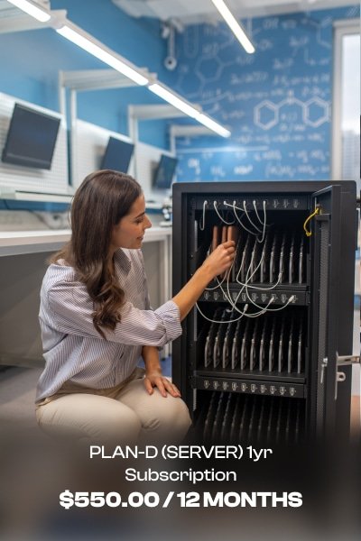 a woman sitting on the floor next to a computer